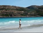 Sonya strolling down Lucky Bay beach